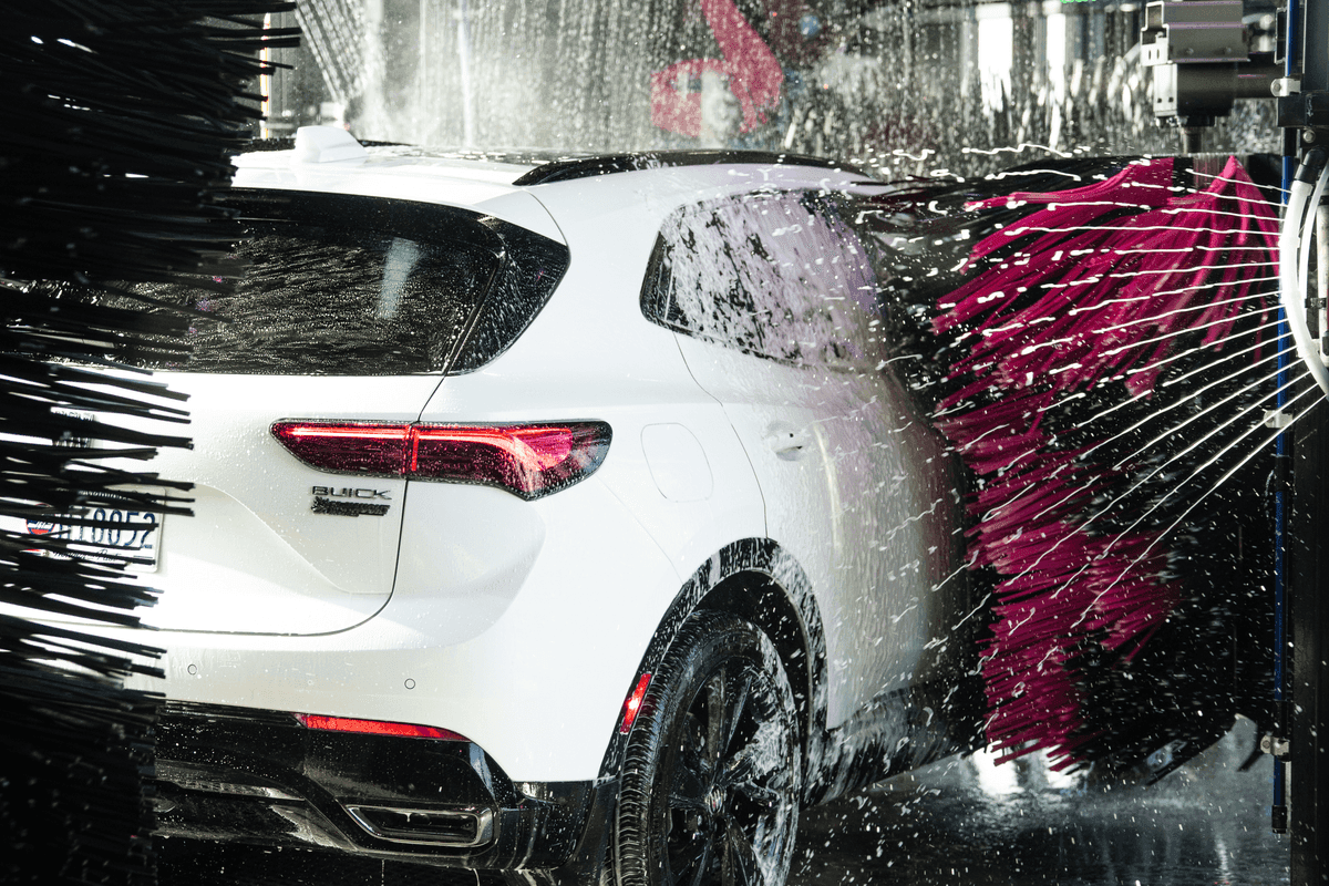 A car moving through the soft-touch wash tunnel
